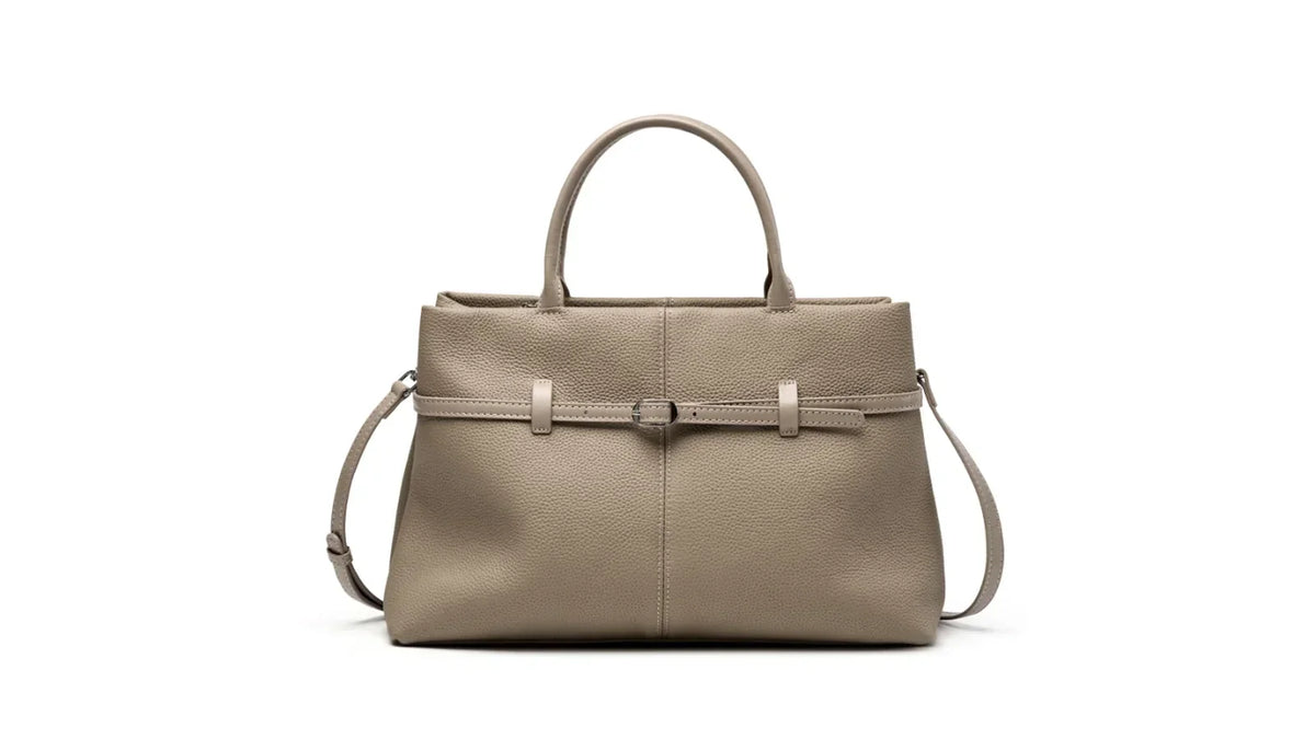 Cuirae taupe pebbled leather work-to-weekend handbag with belt buckle detail on a clean white background