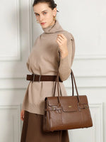 Model wearing Cuirae brown genuine leather everyday tote bag on shoulder, lifestyle shot showing real-world size proportion and daily carry style