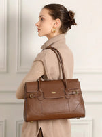 Cuirae chocolate genuine leather everyday tote bag detail closeup showing gold hardware, reinforced top handles, and smooth leather texture