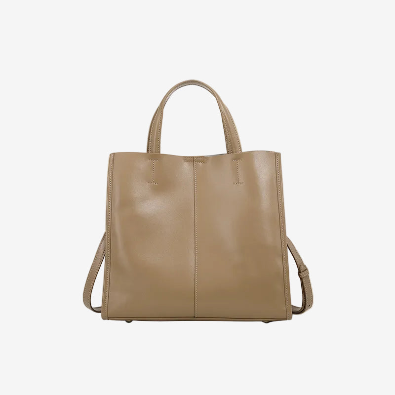 A front view of the Cuirae beige genuine leather tote bag standing on a plain background.