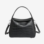 Cuirae black crocodile embossed genuine leather crossbody bag with flap design and detachable strap, front view on white background