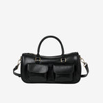 Cuirae off black genuine leather bowling crossbody bag with double pockets, front view showing smooth leather texture
