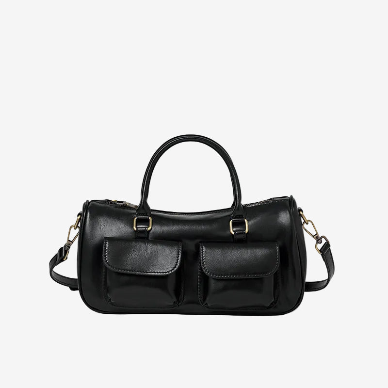 Cuirae off black genuine leather bowling crossbody bag with double pockets, front view showing smooth leather texture
