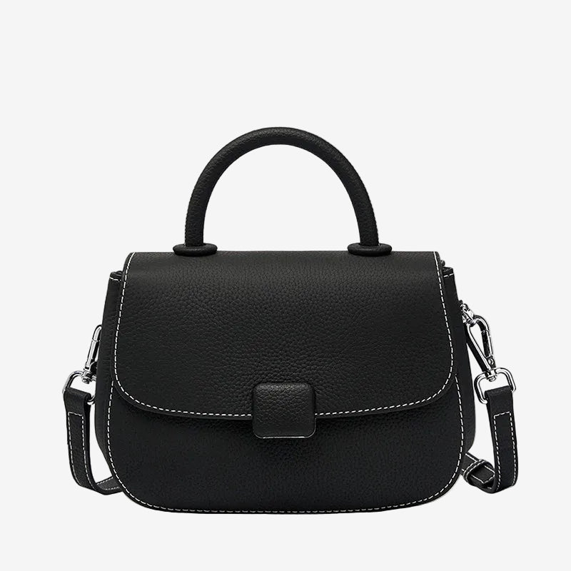 A front view of the Cuirae black genuine leather shoulder bag standing on a plain background