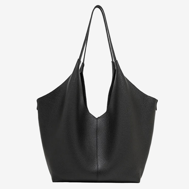 A front view of the Cuirae black genuine leather tote bag standing on a plain background.