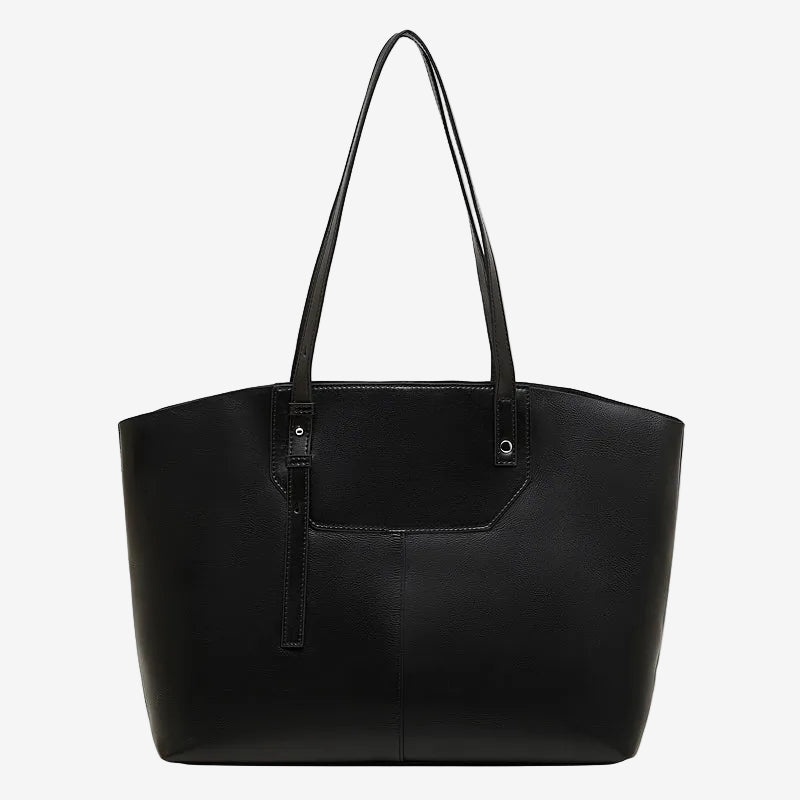 A front view of the Cuirae black genuine leather tote bag standing on a plain background.