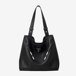 A front view of the Cuirae black genuine leather tote bag standing on a plain background.