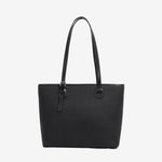 A front view of the Cuirae black genuine leather tote bag standing on a plain background.