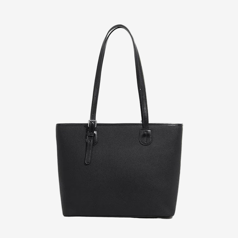 A front view of the Cuirae black genuine leather tote bag standing on a plain background.
