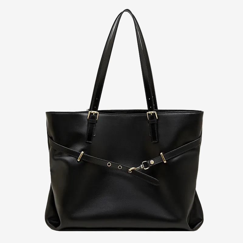 A front view of the Cuirae black genuine leather tote bag standing on a plain background.