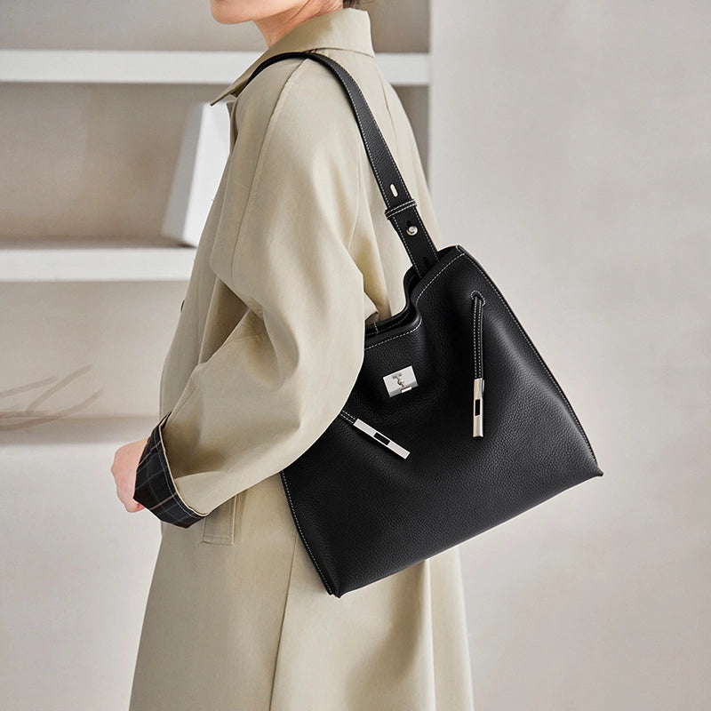 Cuirae black genuine leather shoulder tote bag, angled view showing soft structured silhouette