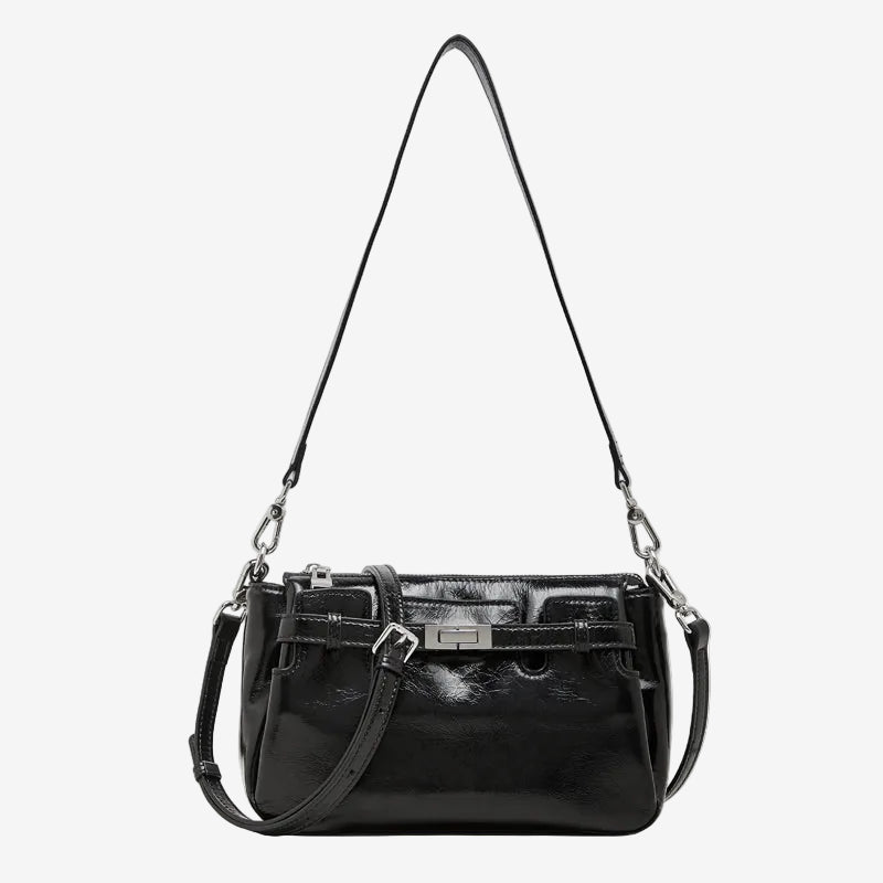 Cuirae black glossy genuine leather crossbody bag with turnlock detail and adjustable strap, front view on white background