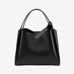 Cuirae black pebbled genuine leather handbag with top handle and detachable shoulder strap, front view on white background
