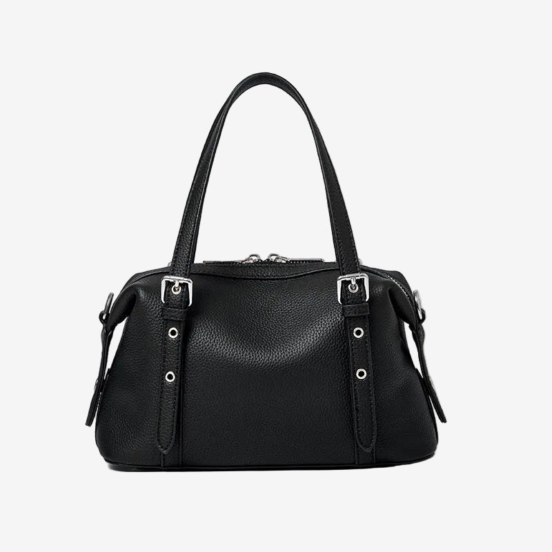 Cuirae black pebbled genuine leather bowling shoulder bag with silver hardware and top handles, front view on white background