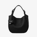 Cuirae black pebbled genuine leather bucket bag with silver hardware and top handle, front view on white background