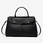 Cuirae black pebbled genuine leather handbag with belt buckle detail and silver hardware, front view on white background
