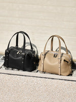 Cuirae black and taupe pebbled genuine leather bowling bags side by side, outdoor scene showing available color options