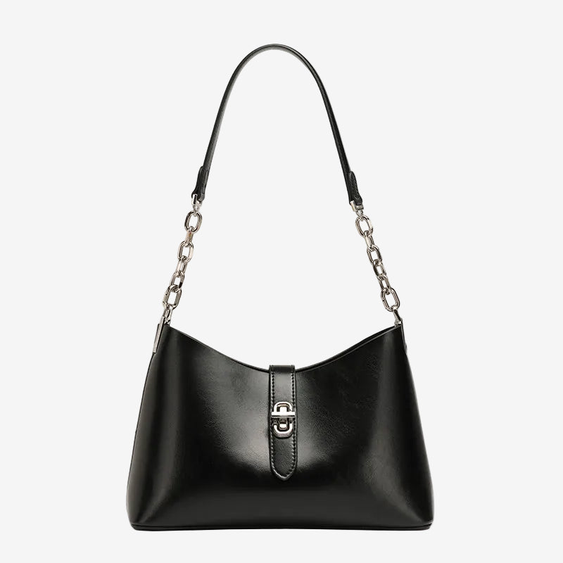 A front view of the Cuirae black top-grain cowhide handbag with a silver lock and chain strap on a white background.