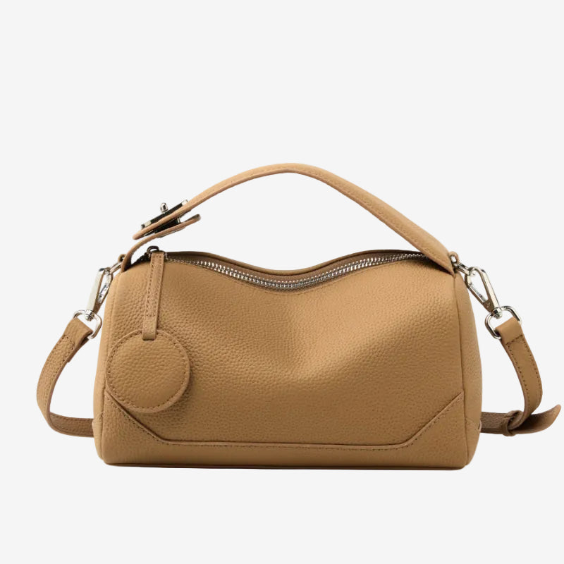 Cuirae bronze pebbled genuine leather bowling handbag with round charm and silver hardware, front view on white background