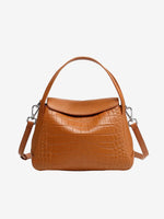 Cuirae brown crocodile embossed genuine leather crossbody bag with flap design and detachable strap, front view on white background