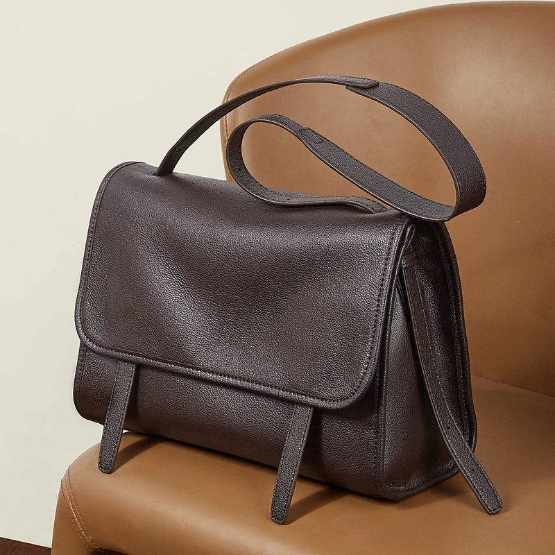 Cuirae  brown full grain leather shoulder messenger bag, angled view showing soft premium leather texture