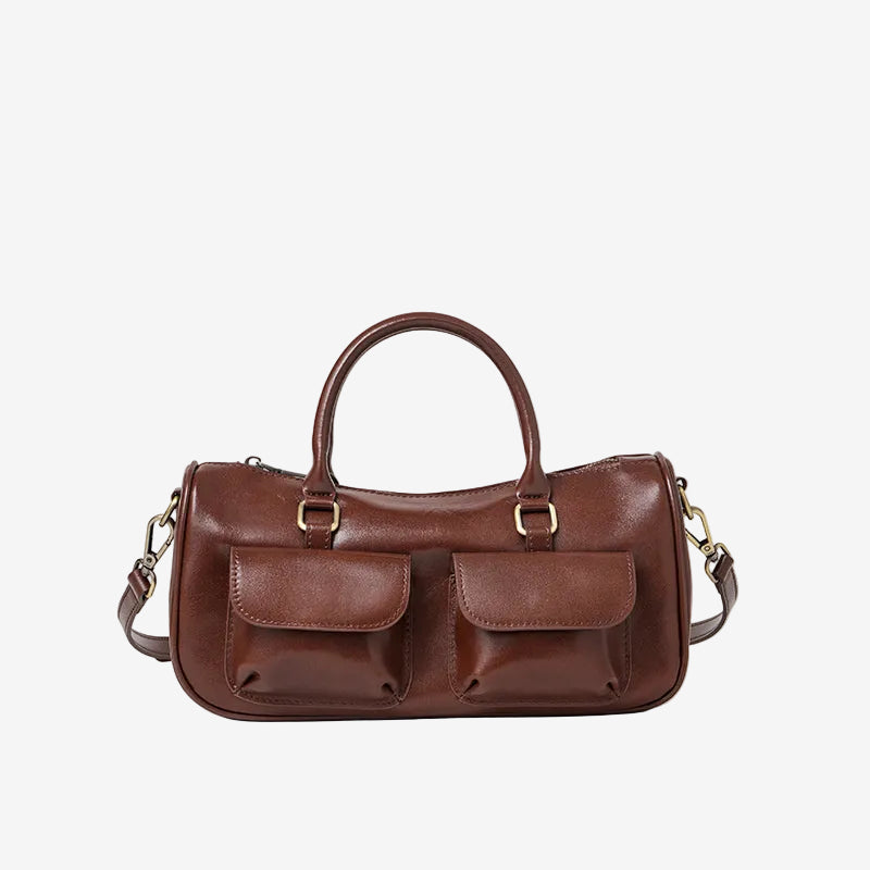 Cuirae off brown genuine leather bowling crossbody bag with double pockets, front view showing smooth leather texture
