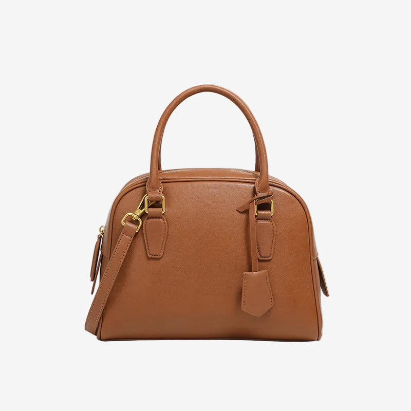 Cuirae  brown genuine leather dome handbag with detachable shoulder strap and tag charm, front view on white background
