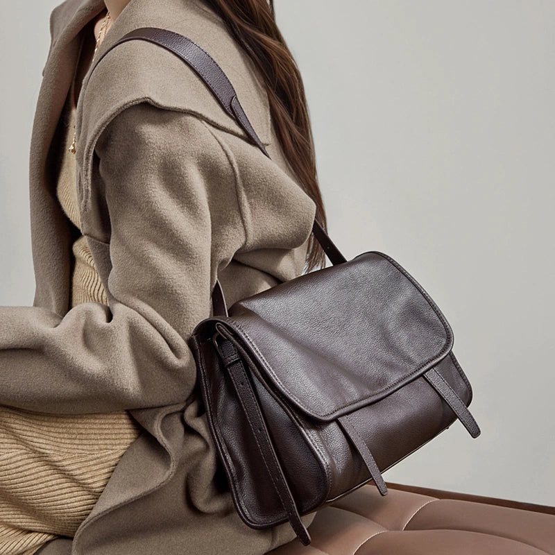 Side view of Cuirae  brown genuine leather shoulder bag worn on shoulder, everyday casual work style