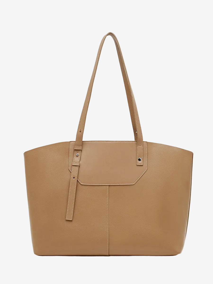 A front view of the Cuirae brown genuine leather tote bag standing on a plain background.