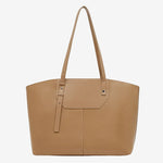 A front view of the Cuirae brown genuine leather tote bag standing on a plain background.