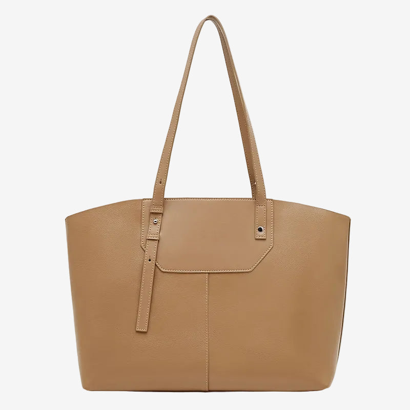 A front view of the Cuirae brown genuine leather tote bag standing on a plain background.