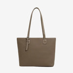 A front view of the Cuirae brown genuine leather tote bag standing on a plain background.