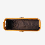 Cuirae brown glossy genuine leather makeup bag top view open, showing black fabric lining on white background