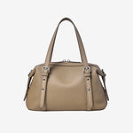 Cuirae brown pebbled genuine leather bowling shoulder bag with silver hardware and top handles, front view on white background