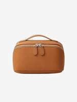 Cuirae brown pebbled genuine leather makeup bag with top handle and double zipper, front view on white background.