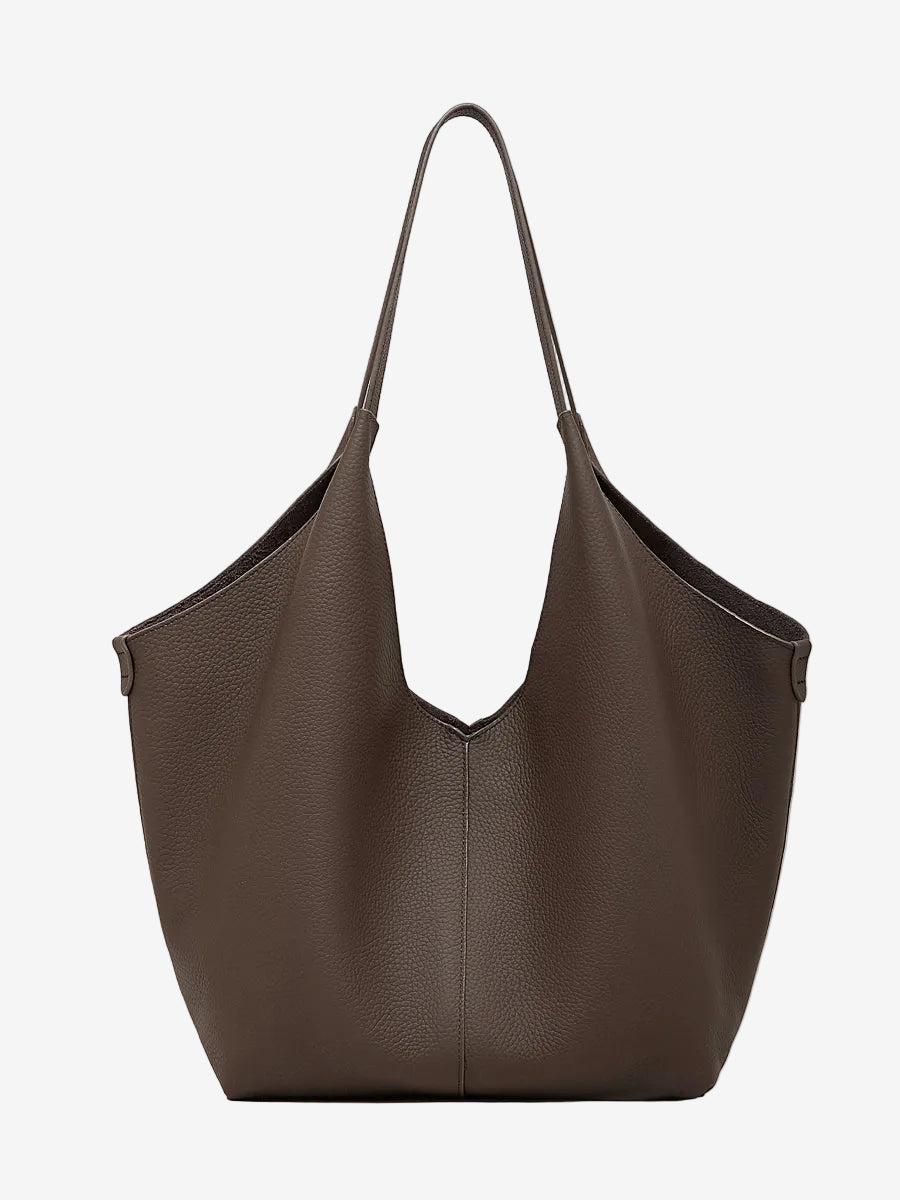 A front view of the Cuirae coffee genuine leather tote bag standing on a plain background.