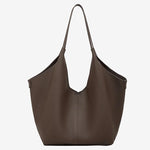 A front view of the Cuirae coffee genuine leather tote bag standing on a plain background.