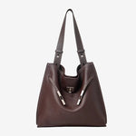 A front view of the Cuirae coffee genuine leather tote bag standing on a plain background.