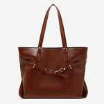 A front view of the Cuirae coffee genuine leather tote bag standing on a plain background.