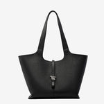 A front view of the Cuirae black genuine leather tote bag standing on a plain background.