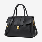 A front view of the Cuirae black genuine leather tote bag standing on a plain background.