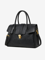 A front view of the Cuirae black genuine leather tote bag standing on a plain background.