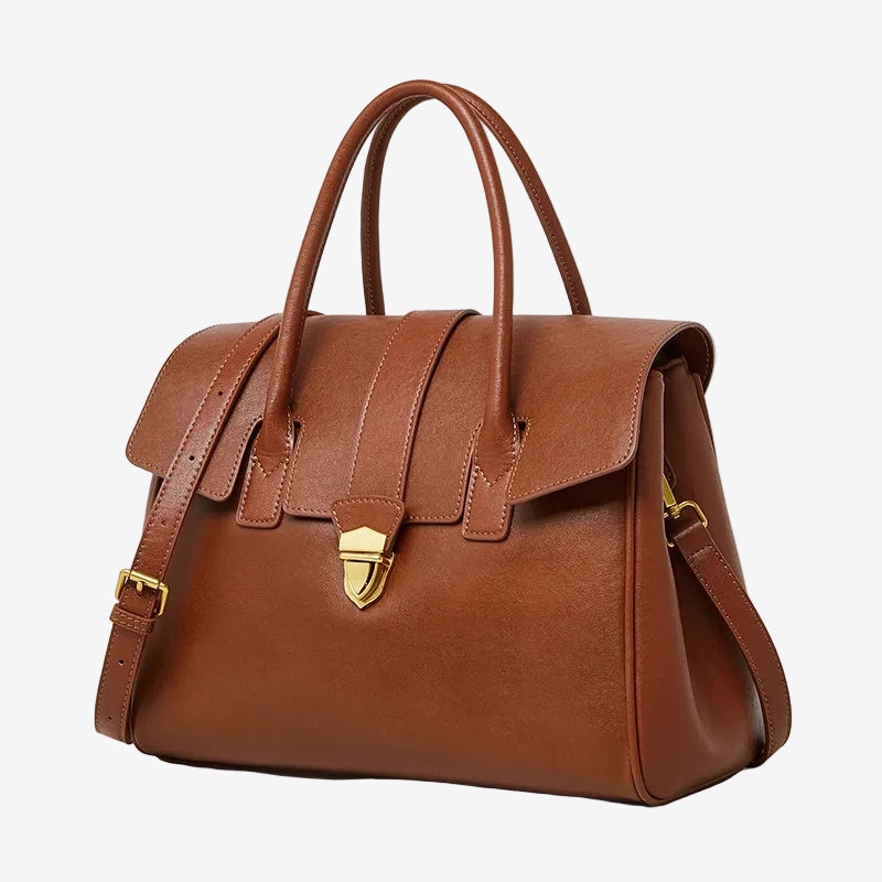 A front view of the Cuirae brown genuine leather tote bag standing on a plain background.