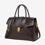 A front view of the Cuirae coffee genuine leather tote bag standing on a plain background.