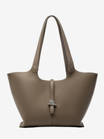 A front view of the Cuirae taupe genuine leather tote bag standing on a plain background.