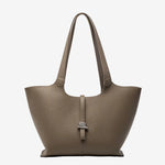 A front view of the Cuirae taupe genuine leather tote bag standing on a plain background.