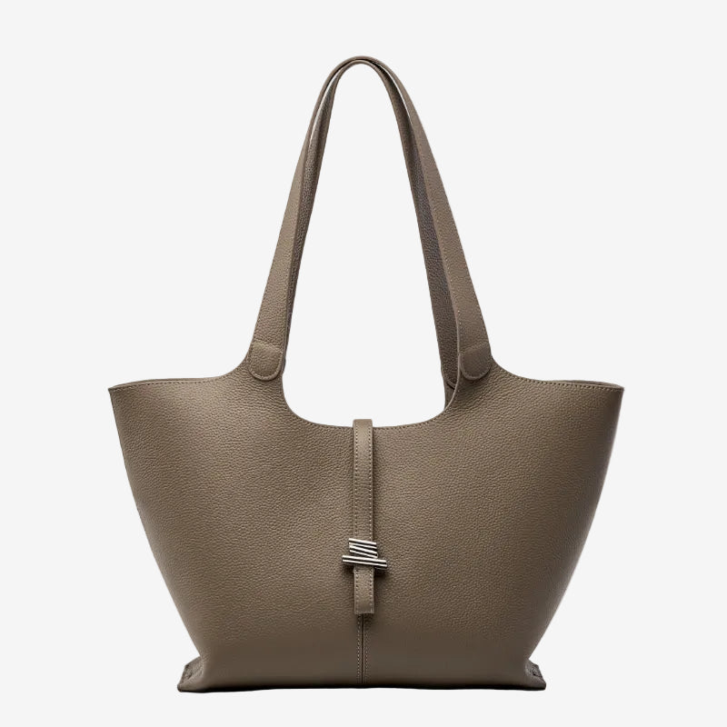 A front view of the Cuirae taupe genuine leather tote bag standing on a plain background.