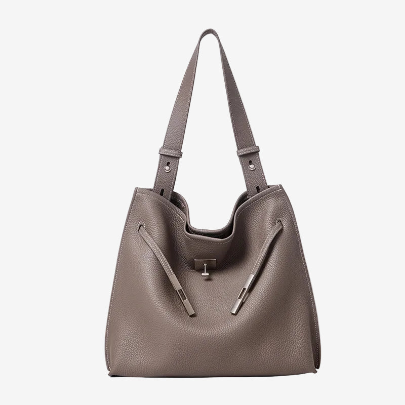 A front view of the Cuirae gray genuine leather tote bag standing on a plain background.