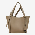 Cuirae gray pebbled genuine leather bucket bag with adjustable strap and silver hardware, front view on white background