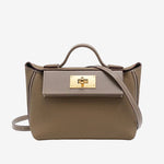 Cuirae gray pebbled genuine leather flap kelly crossbody bag with gold turnlock hardware, front view on white background
